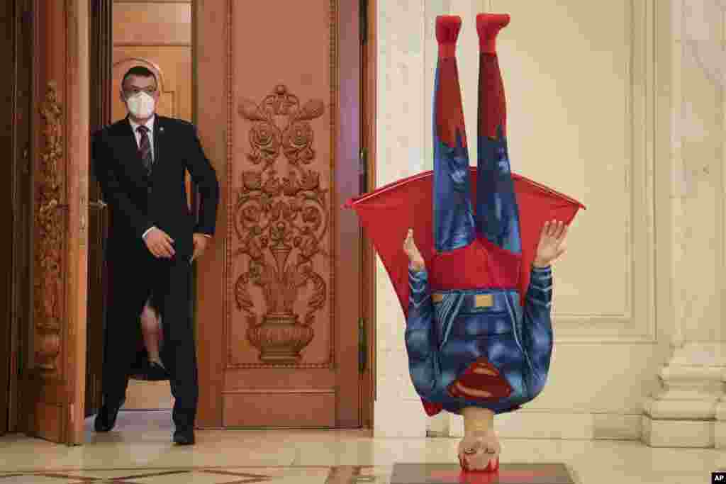 A mannequin depicting Superman is placed upside down next to the door of the parliament session hall hosting a no confidence vote agains Romanian Prime Minister Florin Citu's government in Bucharest, Romania.