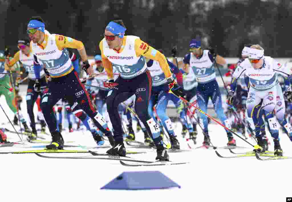 USA's Gus Schumacher, second left, competes during the WSC Men's Mass Start 50km Classic cross country event at the FIS Nordic World Ski Championships in Oberstdorf, Germany.