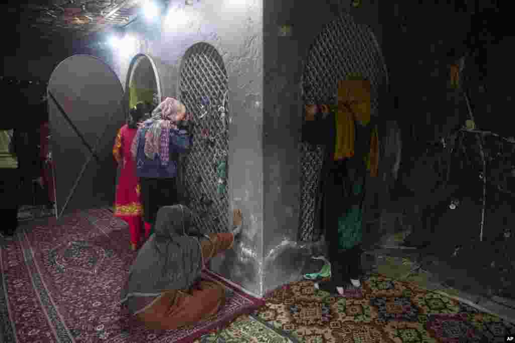 Kashmiri Shi'ite Muslims pray inside the shrine of Peer Syed Mehndi during the Persian New Year, in Srinagar, Indian-controlled Kashmir.