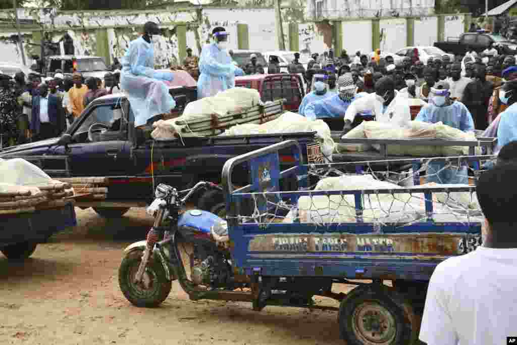 Bodies of people killed by suspected Boko Haram Islamist extremists are transported for burial, in Tarmuwa, northeast Nigeria, Sept. 3, 2024.