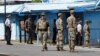 South Korean and U.S. Army soldiers stand guard at the border village of Panmunjom in the Demilitarized Zone, South Korea, Sept. 7, 2018. 