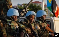 FILE - U.N. peacekeepers from Rwanda wait to escort members of the U.N. Security Council as they arrive at the airport in Juba, South Sudan, Sept. 2, 2016.