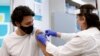 Canada's Prime Minister Justin Trudeau gets a band-aid after being inoculated with AstraZeneca's vaccine against coronavirus disease (COVID-19) at a pharmacy in Ottawa, Ontario, Canada April 23, 2021. 