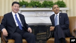 President Barack Obama meets with China then-Vice President Xi Jinping at the White House, Washington, Feb., 14, 2012.