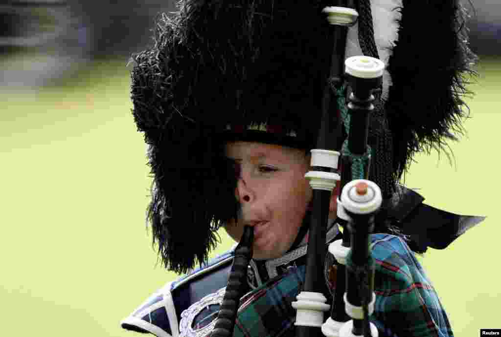 A young piper plays at the annual Braemar Highland Gathering in Braemar, Scotland, Britain, Sept. 3, 2016.