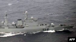 This handout picture taken by the Japanese Defense Ministry on October 16, 2012 shows a Chinese warship ship cruising in waters between two Japanese islands in Okinawa prefecture, in the East China Sea. 