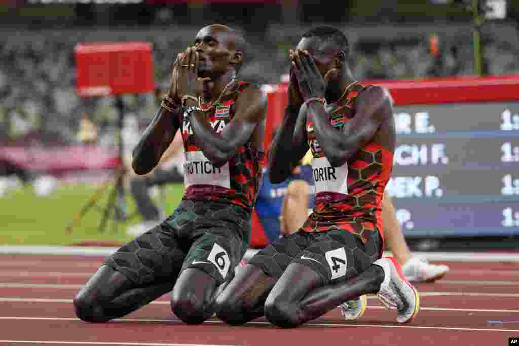 Emmanuel Korir, right, of Kenya, celebrates after winning the gold medal with silver medalist Ferguson Rotich, also of Kenya, in the men's 800-meter final at the 2020 Summer Olympics in Tokyo, Japan.
