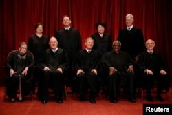 File -- U.S. Supreme Court justices, front row, from left, Ruth Bader Ginsburg, Anthony Kennedy, Chief Justice John Roberts, Clarence Thomas and Stephen Breyer; back row, from left, Elena Kagan, Samuel Alito, Sonia Sotomayor and Associate Justice Neil Gorsuch at the Supreme Court building in Washington, June 1, 2017.