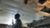 An African refugee surveys a vacant shelter, after an early morning police raid to deport illegal African immigrants, in Tel Aviv, Israel, February 2008. (file photo)