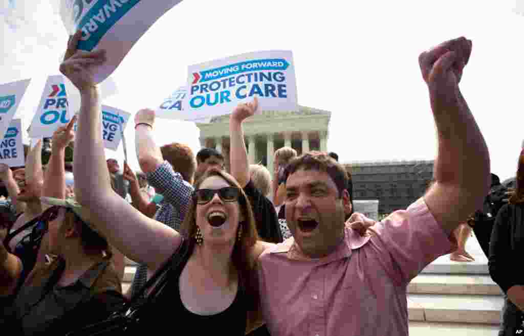 Claire McAndrew and Donny Kirsch, both of Washington, celebrate after the court's ruling.
