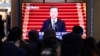 People watch the live broadcast of South Korean President Moon Jae-in's New Year's speech at the Seoul Railway Station in Seoul, South Korea, Jan. 7, 2020. Moon said he hopes to see North Korean leader Kim Jong Un visit the South this year.