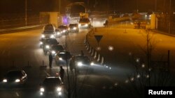 South Korean vehicles return from the inter-Korean Kaesong Industrial Complex in North Korea to the customs, immigration and quarantine (CIQ) office in the South, just south of the demilitarized zone separating the two Koreas in Paju, north of Seoul early