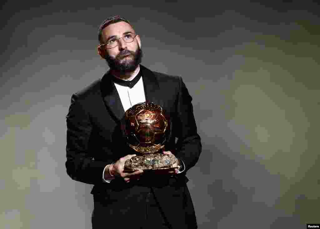 Real Madrid's French forward Karim Benzema reacts after winning the Ballon d'Or award during the 2022 Ballon d'Or France Football award ceremony at the Theatre du Chatelet in Paris, France, Oct.17, 2022.