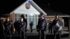 Security officers stand guard outside Orthodox Assyrian church in Sydney, Australia, April 15, 2024. 