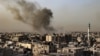 Asap mengepul di atas bangunan di kota Rafah, Jalur Gaza selatan pada 27 Maret 2024, di tengah konflik yang sedang berlangsung antara Israel dan kelompok militan Palestina Hamas.