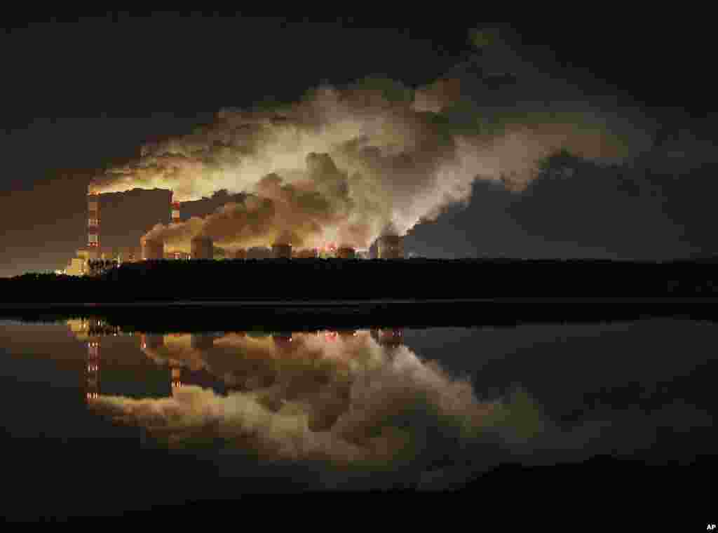 FILE - Plumes of smoke rise from Europe's largest lignite power plant in Belchatow, central Poland, Nov. 28, 2018.