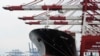 FILE - Containers are loaded onto a cargo ship at the Tianjin port in China. The U.S. needs to intensify its focus on the Indo-Pacific because of the “mounting challenges” posed by China's rise, a Biden administration strategy document says.