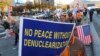 Protesters march toward the U.S. Embassy during a rally supporting the United States' policy to put steady pressure on North Korea in Seoul, South Korea, Nov. 3, 2018.