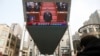 Giant screen shows Chinese President Xi Jinping attending the closing session of the National People's Congress (NPC) at the Great Hall of the People, in Beijing, March 11, 2021.