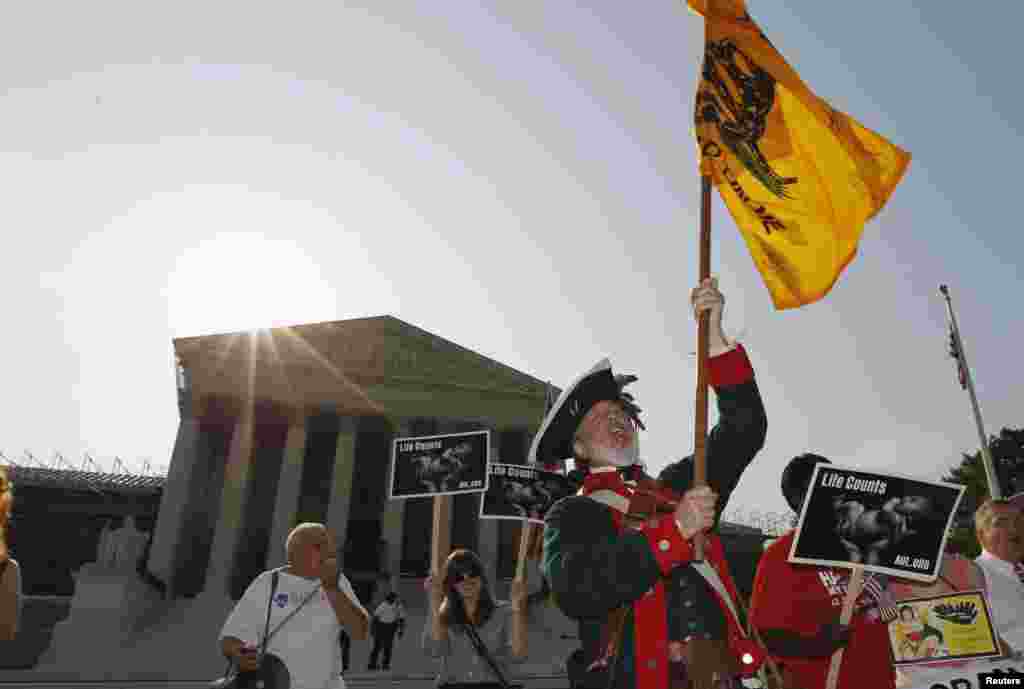Tea Party supporter William Temple protests against President Barack Obama's 2010 health care overhaul outside the Supreme Court.