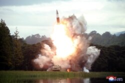 FILE - North Korea test-fires a weapon in this undated photo released Aug. 16, 2019, by the Korean Central News Agency. Pyongyang conducted another launch Aug. 23, violating a promise to U.S. President Donald Trump to refrain from such tests.