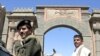 Yemeni security forces guard Bab al-Yemen entrance of Sana'a Old City, 6 Jan 2010