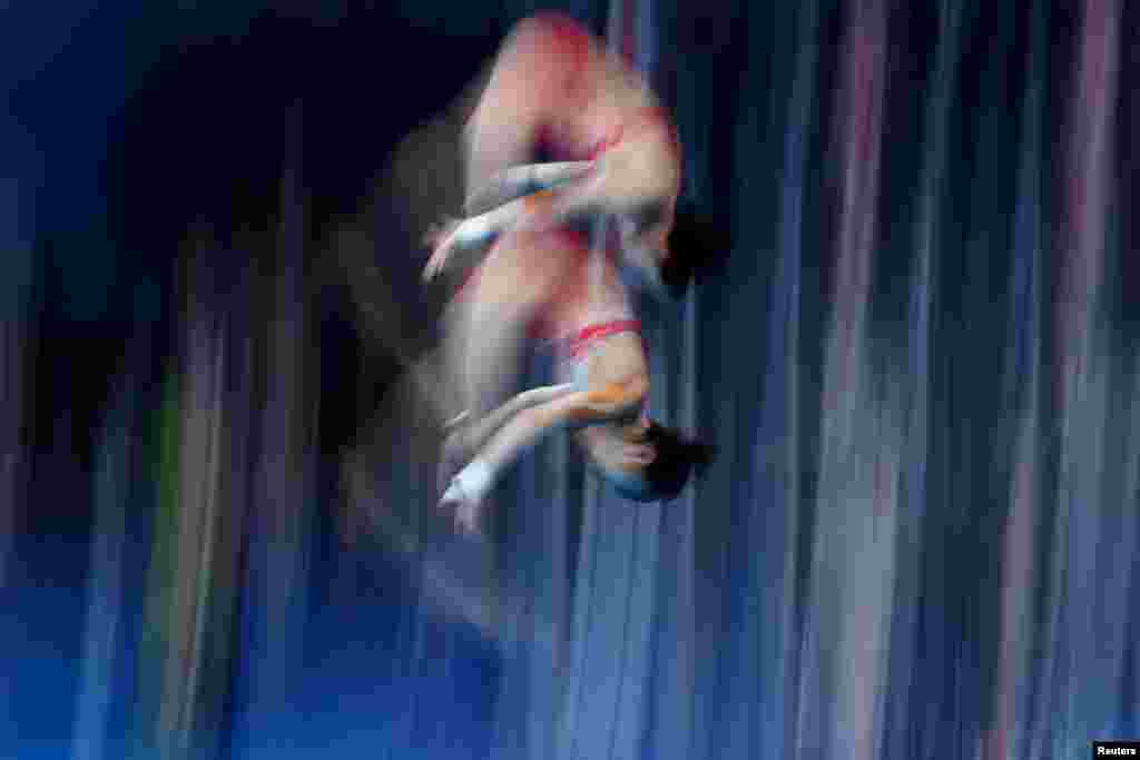 Chen Yuxi of China and Zhang Jiaqi of China compete during the diving final of the women's 10m platform synchro at the Tokyo 2020 Olympics at Tokyo Aquatics Centre, Tokyo, Japan.