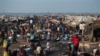 People displaced by violence attempt to create a semblance of daily life, in a sprawling camp at Mpoko Airport, in Bangui, Central African Republic, Thursday, Jan. 2, 2014. Doctors Without Borders temporarily suspended all but emergency care at the clinic