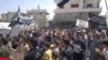 Demonstrators pray during a protest against Syria's President Bashar al-Assad, in Sermeen, near Idlib, Syria, August 17, 2012.