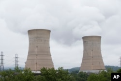 FILE - Cooling towers are shown at the Three Mile Island nuclear power plant in Middletown, Pennsylvania, May 22, 2017.