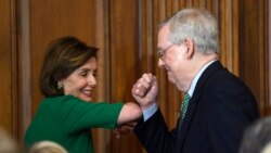 House Speaker Nancy Pelosi of Calif., left, and Senate Majority Leader Mitch McConnell of Ky., right, bump elbows as they attend a lunch with Irish Prime Minister Leo Varadkar on Capitol Hill in Washington, Thursday, March 12, 2020.