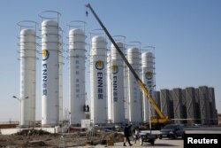 FILE - A liquefied natural gas storage facility of the ENN Group Co is under construction in Baoding, Hebei province, China, Dec. 5, 2017.