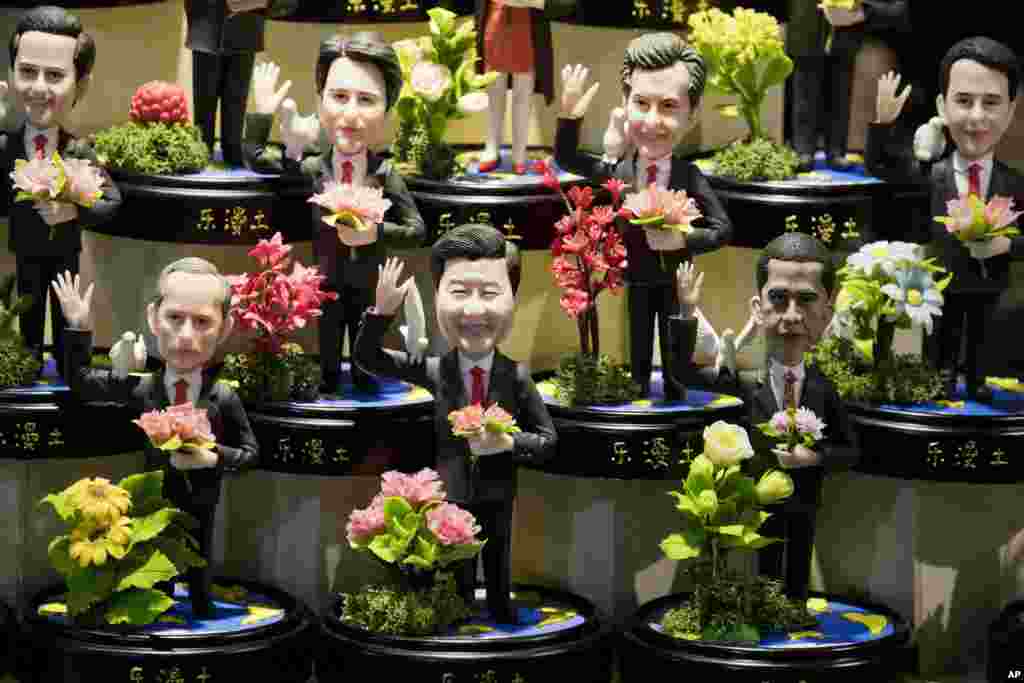 Clay figures, showing U.S. President Barack Obama, Chinese President Xi Jinping and Russian President Vladimir Putin amongst other state leaders expected to attend the G20 summit are displayed at a shop in Hangzhou in eastern China's Zhejiang province.
