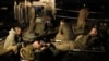 Israeli soldiers rest at a staging area outside the northern Gaza Strip, Nov. 21, 2012.