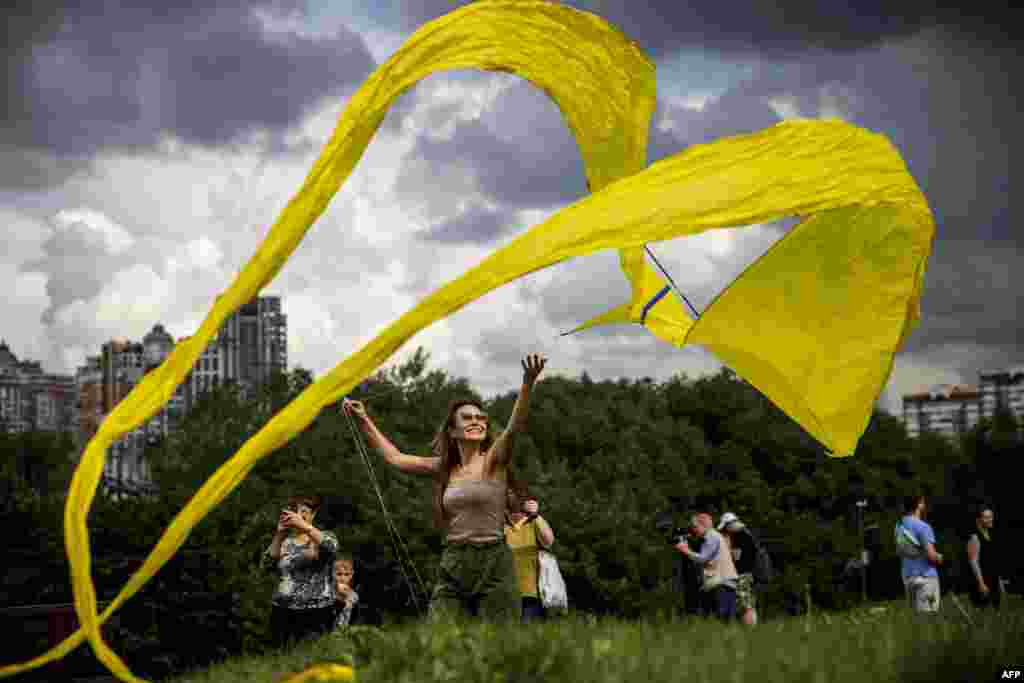A participant flies a kite during the 'Letatlin N4' annual Festival of Kites, in Moscow, Russia, June 6, 2021.