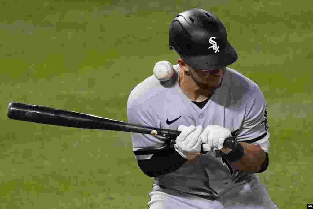 Chicago White Sox's Nick Madrigal is hit by a pitch from Los Angeles Angels relief pitcher Raisel Iglesias during the ninth inning of a baseball game in Anaheim, California, April 4, 2021.