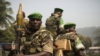 Soldiers from the AU peacekeeping mission prepare to leave at the end of a speech given by Alexandre-Ferdinand Nguendet, the head of Central African Republic's transitional assembly at the Gendarmerie headquarters in Bangui on Jan. 13, 2014. 