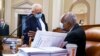 Rep. Bill Pascrell, D-N.J., left, and Rep. Danny Davis, D-Ill., confer as the tax-writing House Ways and Means Committee continues working on a sweeping proposal for tax hikes on big corporations and the wealthy, at the Capitol, Sept. 14, 2021.