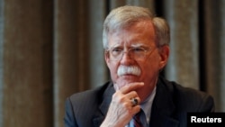 FILE - U.S. National Security Advisor, John Bolton, meets with journalists during a visit to London, Britain.