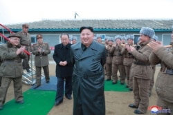 North Korean leader Kim Jong Un oversees a super-large multiple launch rocket system test in this undated picture released by North Korea's Central News Agency, Nov. 28, 2019.