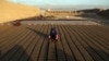 In this June 19, 2019, photo, Afghan children help their father with work at a brick factory on the outskirts of of Kabul, Afghanistan.