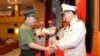 Tô Lâm, khi còn là bộ trưởng Công an, bắt tay Nguyễn Duy Ngọc khi trao quyết định bổ nhiệm thứ trưởng Công an hôm 15/8/2019. Ông Ngọc được bổ nhiệm lãnh đạo UBKTTW hôm 24/1.