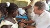 FILE - A staff member of the Global Alliance for Vaccines and Immunization inoculates a child with a rotavirus vaccine at in the village of Nkyenoa, Ghana, April 27, 2012. The WHO said up to 200,000 children globally die of the diarrheal disease each year. 