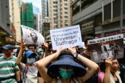People take part in the 'Prayer walk for Sinners' rally in Hong Kong, Aug. 31, 2019. Thousands of pro-democracy protesters defied a police ban on rallying, a day after several leading activists were arrested.