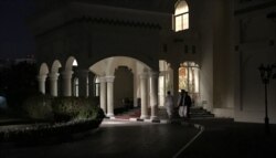FILE - Members of a Taliban negotiating team enter the venue hosting U.S.-Taliban talks in the Qatari capital Doha, Aug. 29, 2019.