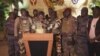 Gambar yang diambil dari video ini menunjukkan juru bicara tentara pemberontak mengumumkan perebutan kekuasaan di Libreville, dalam pidato yang disiarkan melalui televisi, 30 Agustus 2023. (GABON 24 via AP)
