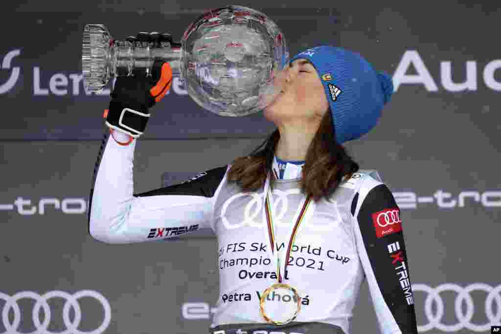 Slovakia's Petra Vlhova kisses the trophy of the alpine ski, women's World Cup overall title, in Lenzerheide, Switzerland.