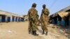 South Sudan army soldiers talk to each other in Malakal town, 497km (308 miles) northeast of Juba, Dec. 30, 2013. 