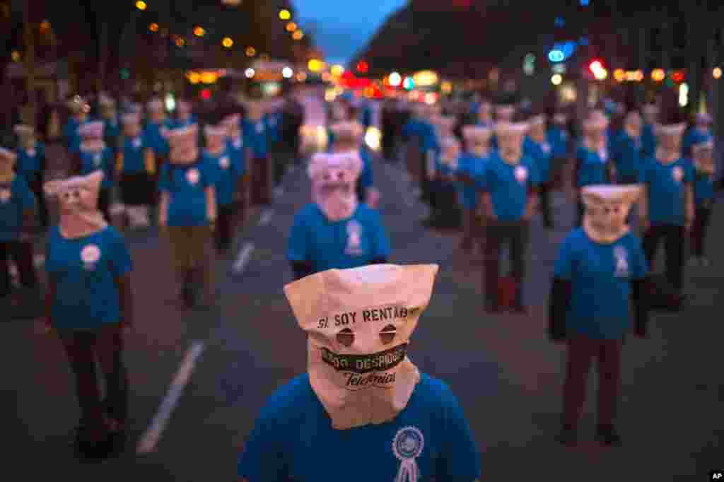 Workers from Telefonica phone company take part in a demonstration against the dismissals at their company in Barcelona, Spain, November 13, 2012.