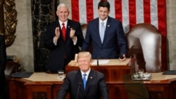 President Donald Trump steps to the podium to begin his State of the Union address to a joint session of Congress on Capitol Hill in Washington, Jan. 30, 2018. Behind Trump are Vice President Mike Pence and House Speaker Paul Ryan of Wisconsin.